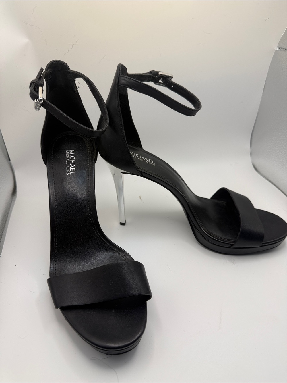 MICHAEL Michael Kors Black Leather Ankle-Strap Stiletto Sandals with Silver Heel